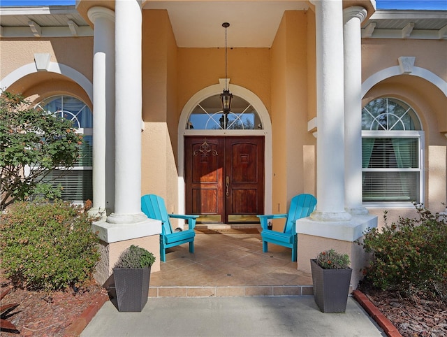 4675 Ficus Dr, Beverly Hills, FL 34465 - property entrance featuring a porch and stucco siding
