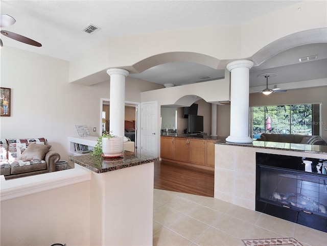 4675 Ficus Dr, Beverly Hills, FL 34465 - kitchen featuring open floor plan, ceiling fan, and decorative columns