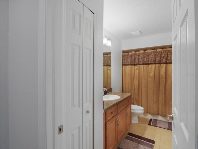 4675 Ficus Dr, Beverly Hills, FL 34465 - bathroom featuring tile patterned floors, toilet, a closet, and vanity