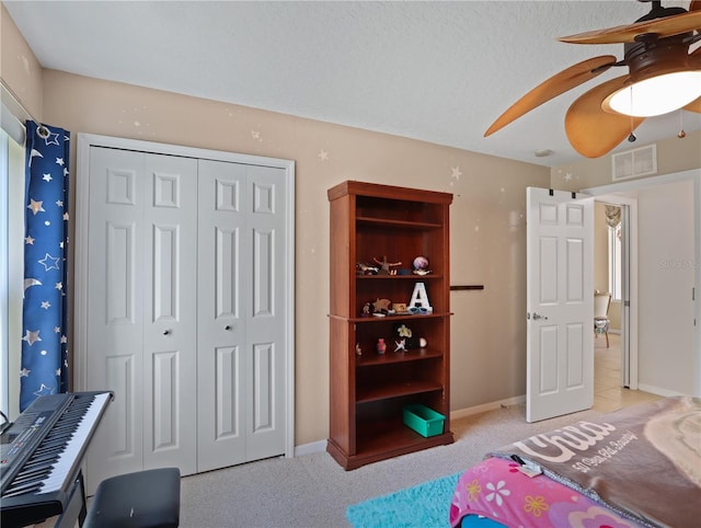 4675 Ficus Dr, Beverly Hills, FL 34465 - bedroom with a closet, ceiling fan, visible vents, baseboards, and light colored carpet