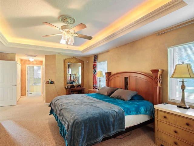 4675 Ficus Dr, Beverly Hills, FL 34465 - bedroom featuring ceiling fan, light carpet, a tray ceiling, and multiple windows