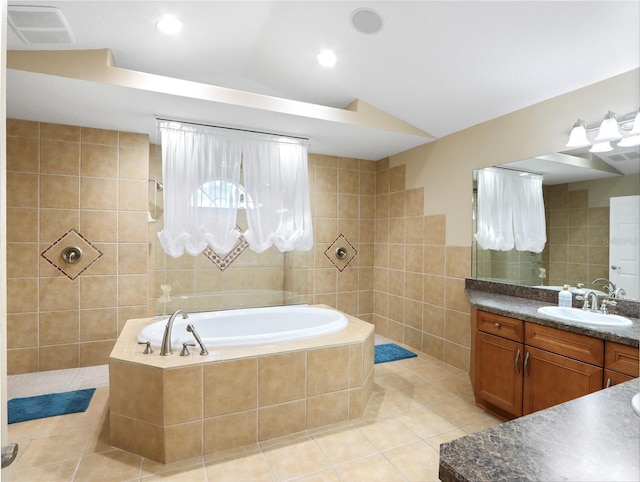4675 Ficus Dr, Beverly Hills, FL 34465 - bathroom with tile patterned flooring, tile walls, a bath, vanity, and visible vents