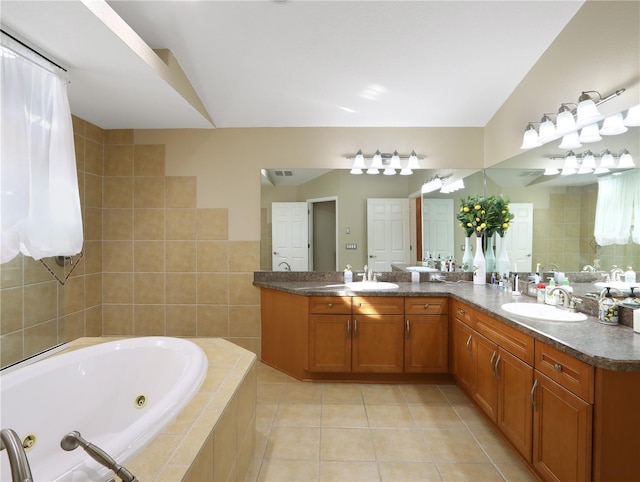 4675 Ficus Dr, Beverly Hills, FL 34465 - full bath with a jetted tub, tile patterned flooring, double vanity, and a sink