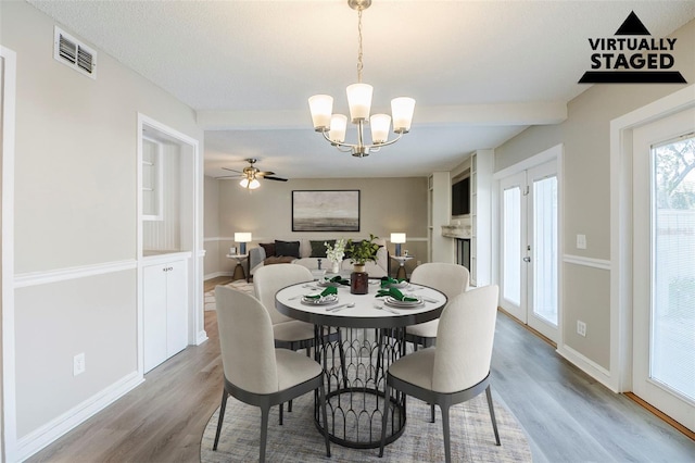 121 Primrose Dr, Longwood, FL 32779 - dining room with wood finished floors, a chandelier, and baseboards
