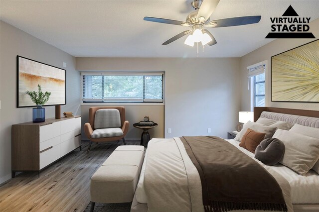 121 Primrose Dr, Longwood, FL 32779 - bedroom featuring wood finished floors, multiple windows, ceiling fan, and baseboards