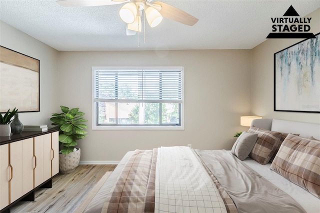 121 Primrose Dr, Longwood, FL 32779 - bedroom featuring light wood finished floors, baseboards, a textured ceiling, and ceiling fan