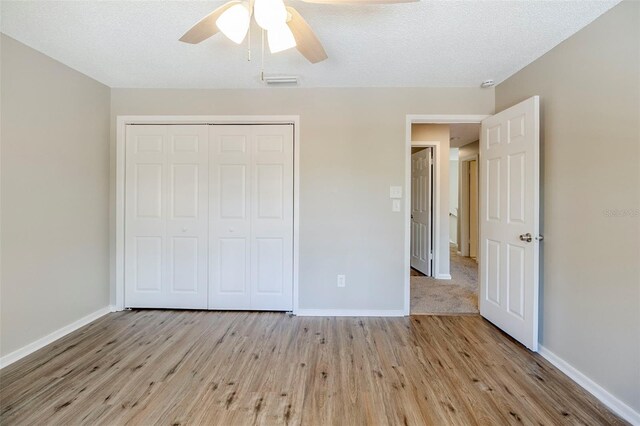 121 Primrose Dr, Longwood, FL 32779 - unfurnished bedroom with wood finished floors, baseboards, and a closet