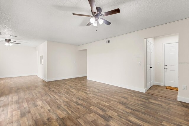 4038 Versailles Dr Unit 4038C, Orlando, FL 32808 - spare room featuring a textured ceiling, visible vents, baseboards, wood finished floors, and ceiling fan