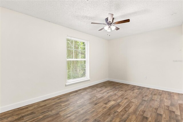 4038 Versailles Dr Unit 4038C, Orlando, FL 32808 - empty room featuring baseboards, a ceiling fan, wood finished floors, and a textured ceiling