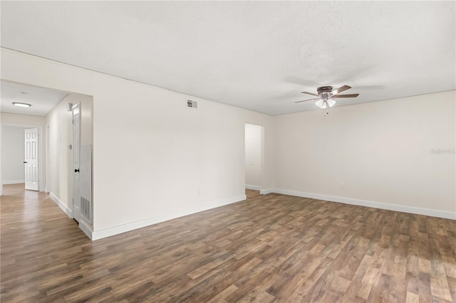 4038 Versailles Dr Unit 4038C, Orlando, FL 32808 - empty room featuring wood finished floors, baseboards, and ceiling fan