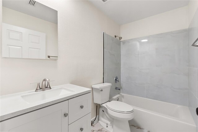 4038 Versailles Dr Unit 4038C, Orlando, FL 32808 - bathroom featuring toilet, visible vents, marble finish floor, vanity, and shower / tub combination