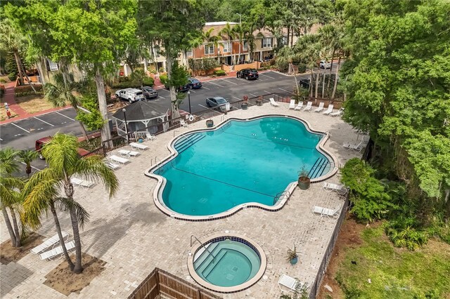 4038 Versailles Dr Unit 4038C, Orlando, FL 32808 - pool featuring a community hot tub