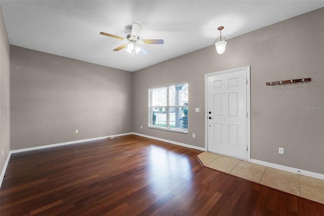 16064 Old Ash Loop, Orlando, FL 32828 - entryway with baseboards, a ceiling fan, and wood finished floors