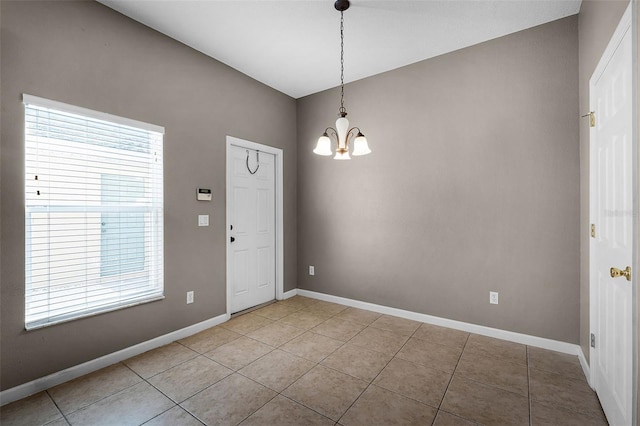 16064 Old Ash Loop, Orlando, FL 32828 - interior space with baseboards, plenty of natural light, light tile patterned flooring, and a chandelier