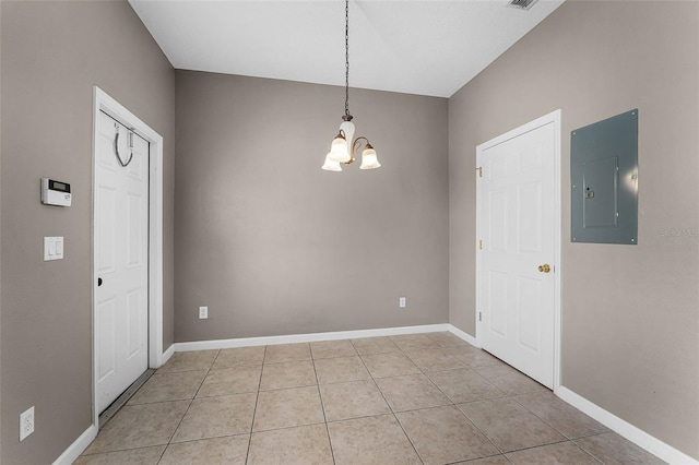 16064 Old Ash Loop, Orlando, FL 32828 - unfurnished dining area featuring an inviting chandelier, baseboards, light tile patterned flooring, and electric panel