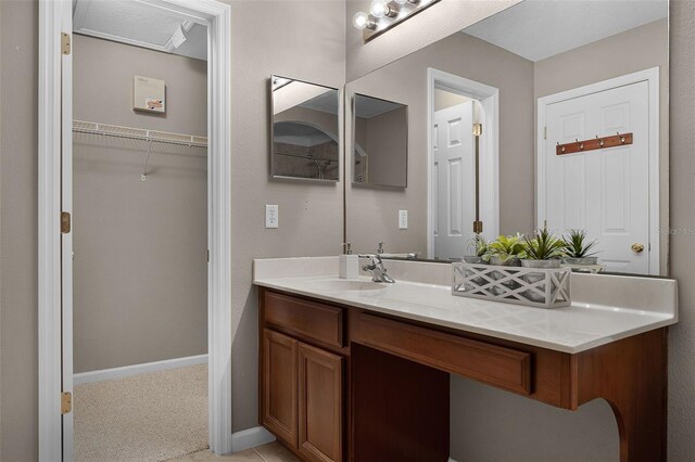 16064 Old Ash Loop, Orlando, FL 32828 - bathroom with vanity and baseboards