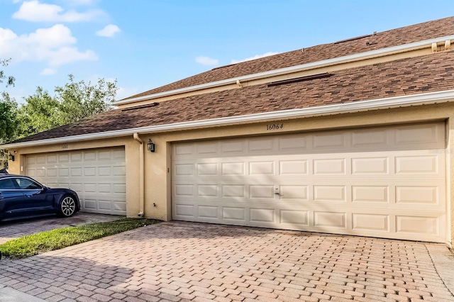 16064 Old Ash Loop, Orlando, FL 32828 - garage featuring decorative driveway