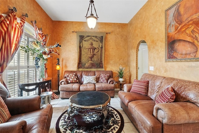 1714 Sweetwater W Cir, Apopka, FL 32712 - tiled living area featuring arched walkways and a textured wall