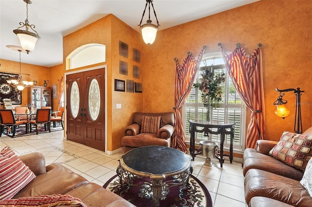 1714 Sweetwater W Cir, Apopka, FL 32712 - tiled foyer entrance featuring a high ceiling, baseboards, and an inviting chandelier