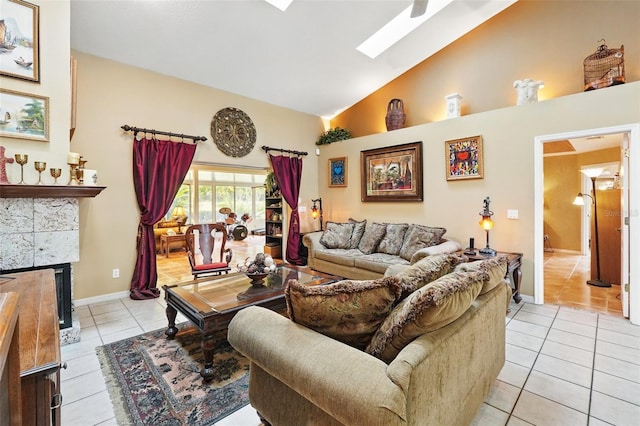 1714 Sweetwater W Cir, Apopka, FL 32712 - living room featuring baseboards, high vaulted ceiling, a skylight, a fireplace, and light tile patterned floors