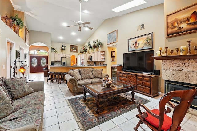 1714 Sweetwater W Cir, Apopka, FL 32712 - living room featuring light tile patterned flooring, visible vents, high vaulted ceiling, and ceiling fan