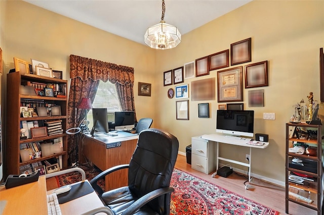 1714 Sweetwater W Cir, Apopka, FL 32712 - office area featuring baseboards, wood finished floors, and an inviting chandelier