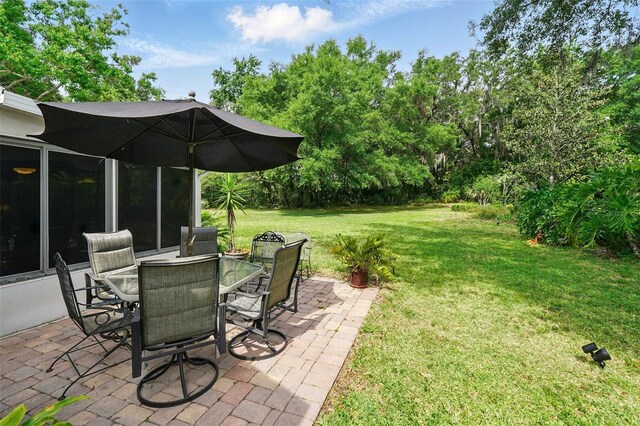 1714 Sweetwater W Cir, Apopka, FL 32712 - view of yard featuring a patio area and outdoor dining space