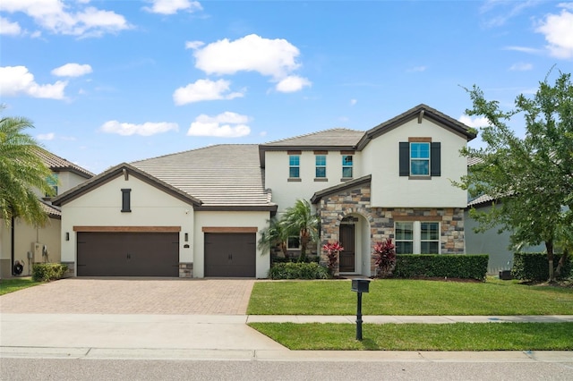 8017 Chilton Dr, Orlando, FL 32836 - view of front facade featuring stone siding, stucco siding, driveway, and a front lawn