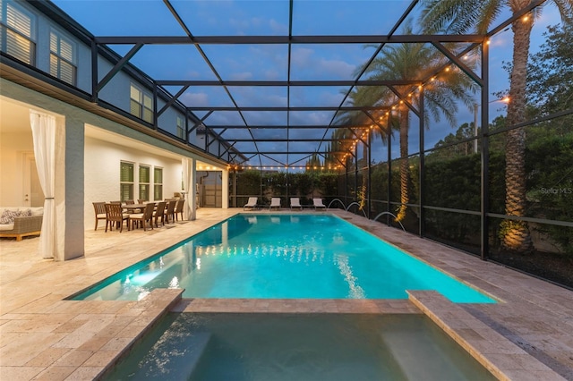 8017 Chilton Dr, Orlando, FL 32836 - view of pool featuring a patio, a pool with connected hot tub, a lanai, and outdoor dining area