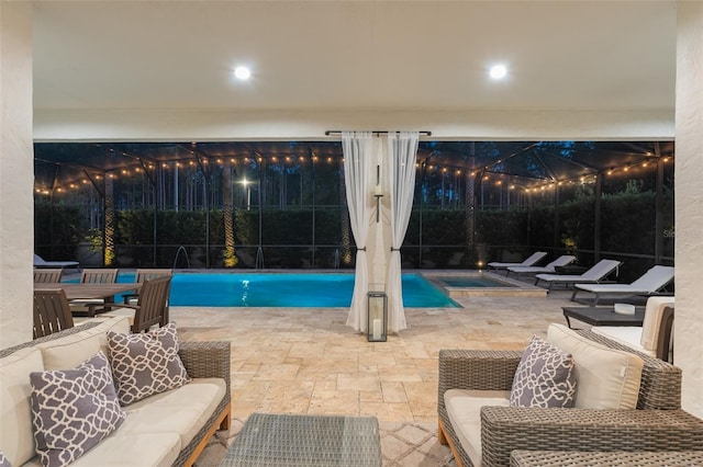 8017 Chilton Dr, Orlando, FL 32836 - pool at night with an outdoor pool, a patio, and glass enclosure