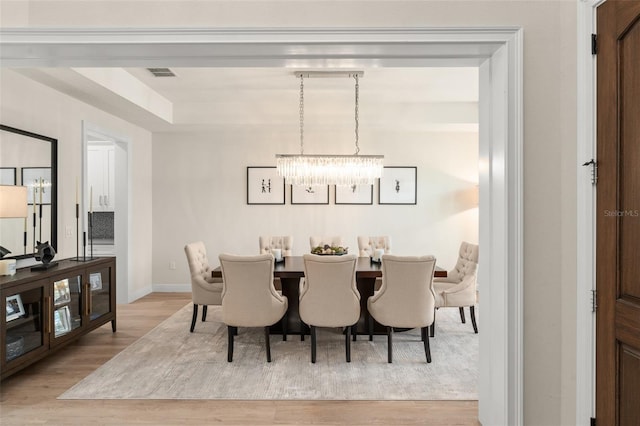 8017 Chilton Dr, Orlando, FL 32836 - dining space with wood finished floors, a chandelier, and baseboards