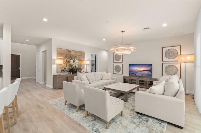 8017 Chilton Dr, Orlando, FL 32836 - living area featuring light wood-type flooring, recessed lighting, a chandelier, and baseboards