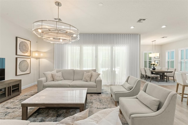 8017 Chilton Dr, Orlando, FL 32836 - living room with light wood-style floors, baseboards, and recessed lighting
