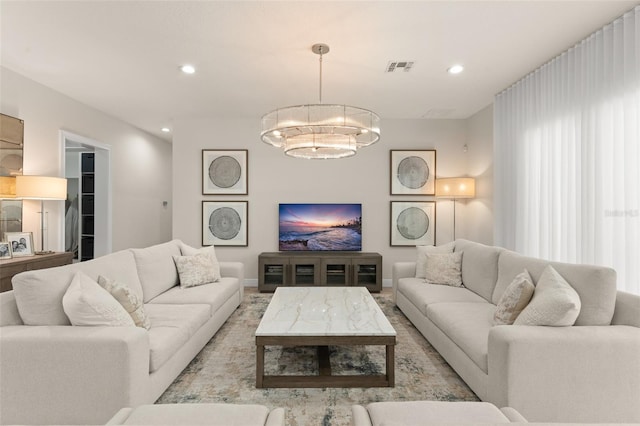 8017 Chilton Dr, Orlando, FL 32836 - living room featuring a chandelier, recessed lighting, and baseboards