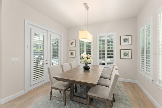 8017 Chilton Dr, Orlando, FL 32836 - dining room with light wood-style flooring and baseboards
