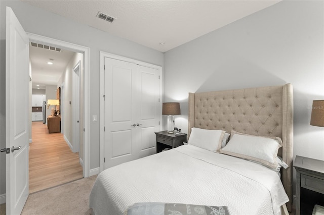 8017 Chilton Dr, Orlando, FL 32836 - bedroom with a closet, baseboards, and light colored carpet
