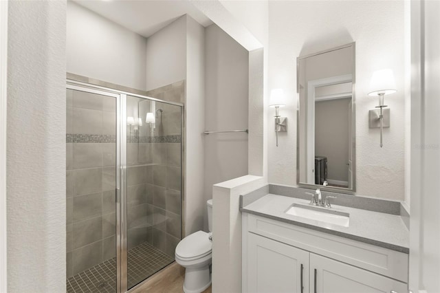 8017 Chilton Dr, Orlando, FL 32836 - bathroom featuring a stall shower, toilet, and vanity