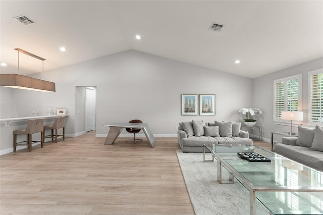 8017 Chilton Dr, Orlando, FL 32836 - living room with lofted ceiling, recessed lighting, light wood finished floors, and baseboards