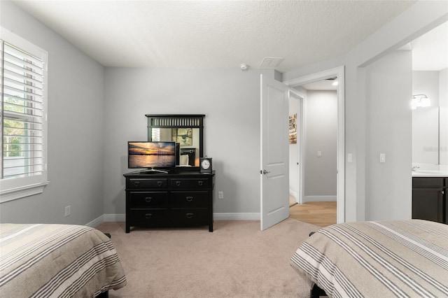 8017 Chilton Dr, Orlando, FL 32836 - bedroom featuring light carpet, a sink, baseboards, and a textured ceiling
