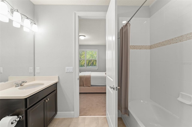 8017 Chilton Dr, Orlando, FL 32836 - bathroom featuring vanity, baseboards, tile patterned flooring, shower / tub combo, and ensuite bathroom
