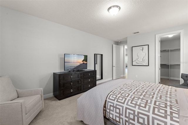 8017 Chilton Dr, Orlando, FL 32836 - carpeted bedroom with baseboards, a spacious closet, a closet, and a textured ceiling
