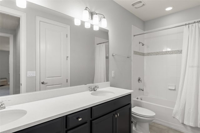 8017 Chilton Dr, Orlando, FL 32836 - bathroom featuring shower / bath combo with shower curtain, double vanity, toilet, tile patterned floors, and recessed lighting