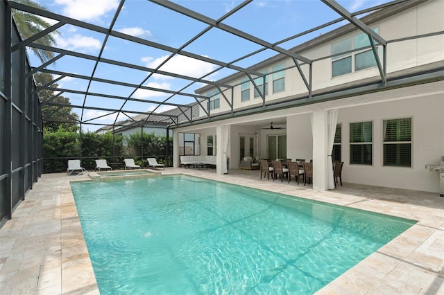 8017 Chilton Dr, Orlando, FL 32836 - view of pool featuring a patio area, a ceiling fan, outdoor dining space, an outdoor hangout area, and a lanai
