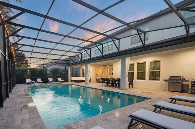 8017 Chilton Dr, Orlando, FL 32836 - swimming pool featuring a patio area, a ceiling fan, outdoor dining area, and a lanai