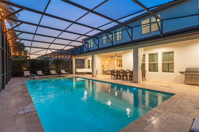 8017 Chilton Dr, Orlando, FL 32836 - pool at dusk featuring an outdoor pool, a patio area, and a lanai