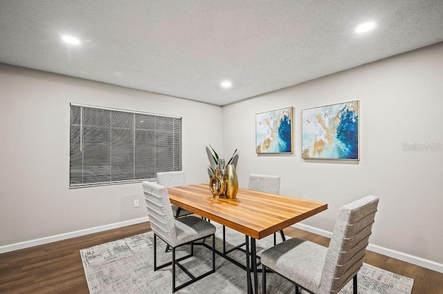 dining space with recessed lighting, wood finished floors, and baseboards