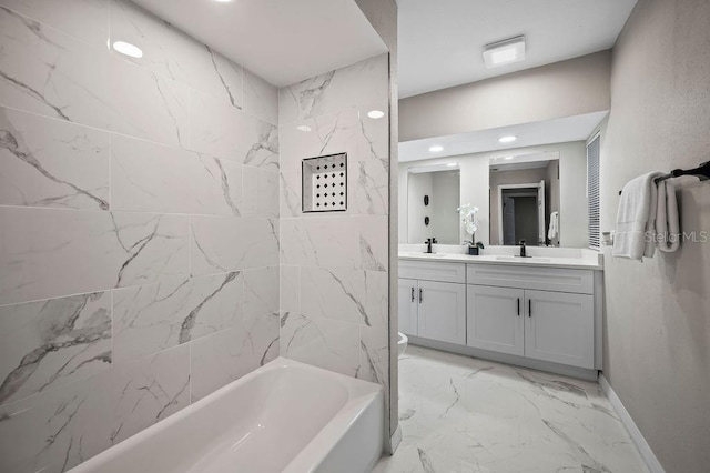 bathroom featuring recessed lighting, double vanity, marble finish floor, baseboards, and washtub / shower combination