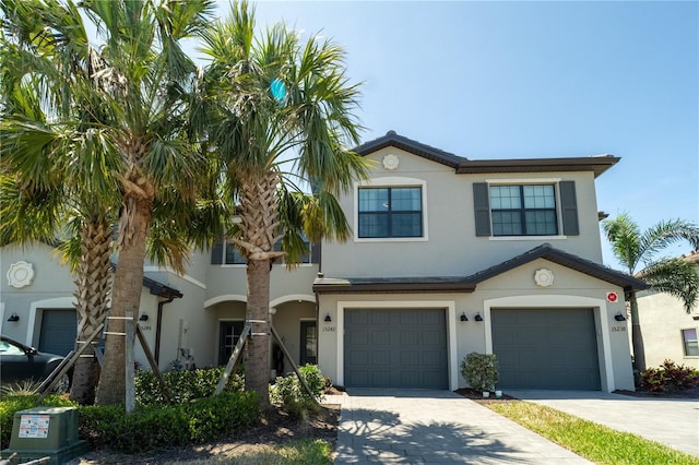 15242 Sunny Day Dr, Bradenton, FL 34211 - view of front of property featuring stucco siding, driveway, and an attached garage