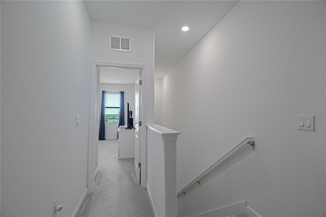 15242 Sunny Day Dr, Bradenton, FL 34211 - corridor with baseboards, visible vents, light carpet, and an upstairs landing