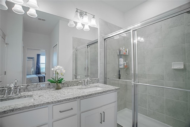 15242 Sunny Day Dr, Bradenton, FL 34211 - ensuite bathroom with visible vents, a shower stall, ensuite bath, and a sink